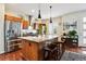 Modern kitchen with stainless steel appliances and a central island with barstool seating at 3379 Cranston Cir, Littleton, CO 80126