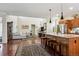 Open-concept kitchen featuring stainless steel appliances and a large island at 3379 Cranston Cir, Littleton, CO 80126