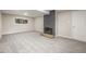Finished basement with gray carpet and a fireplace at 12883 E Nevada Cir, Aurora, CO 80012