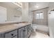 Well lit bathroom with a bathtub, shower, toilet, and vanity at 12883 E Nevada Cir, Aurora, CO 80012