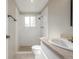A well lit bathroom with a shower and vanity at 12883 E Nevada Cir, Aurora, CO 80012