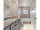 Well lit bathroom with a bathtub, shower, toilet, and vanity at 12883 E Nevada Cir, Aurora, CO 80012