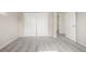 A bright bedroom with neutral walls, carpet, and a closet at 12883 E Nevada Cir, Aurora, CO 80012
