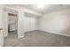 A bedroom with neutral walls, carpet, and laundry in the background at 12883 E Nevada Cir, Aurora, CO 80012