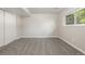 A bright bedroom with neutral walls, carpet, and a window at 12883 E Nevada Cir, Aurora, CO 80012