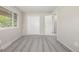 A bright bedroom with neutral walls, carpet, and a closet at 12883 E Nevada Cir, Aurora, CO 80012