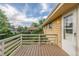 Outdoor deck with white railings overlooking a backyard, attached to a pale yellow home at 12883 E Nevada Cir, Aurora, CO 80012