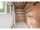 A storage room with wooden shelving and concrete floor at 12883 E Nevada Cir, Aurora, CO 80012
