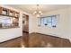 Elegant dining room featuring hardwood floors, natural light, and stylish chandelier at 270 Terra Vista St, Brighton, CO 80601