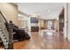 Finished basement with hardwood floors and wet bar at 10010 Steeplechase Dr, Franktown, CO 80116