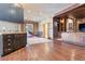 Finished basement featuring a wet bar, built-in shelving, and a sitting area at 10010 Steeplechase Dr, Franktown, CO 80116