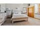 Charming bedroom with a queen-size bed and built-in dresser at 10010 Steeplechase Dr, Franktown, CO 80116