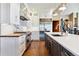 Modern kitchen with white cabinets, wood countertops, and high-end appliances at 10010 Steeplechase Dr, Franktown, CO 80116