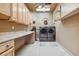 Laundry room with washer, dryer, and cabinets at 10010 Steeplechase Dr, Franktown, CO 80116