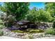 Stunning tiered waterfall feature in the backyard at 10010 Steeplechase Dr, Franktown, CO 80116