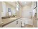 Cozy bathroom with a bathtub, shower, vanity, and decorative tiling at 775 Woodgate Dr, Highlands Ranch, CO 80126
