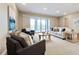 Bright living room with large sliding doors, comfortable seating, and neutral tones at 775 Woodgate Dr, Highlands Ranch, CO 80126