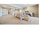 Spacious living room with neutral carpet, lots of natural light, and comfortable seating area at 775 Woodgate Dr, Highlands Ranch, CO 80126