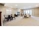 Open concept living area with a walkout patio and plenty of natural light at 775 Woodgate Dr, Highlands Ranch, CO 80126
