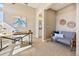 Home office with a neutral color palette, large desk, and comfortable seating at 775 Woodgate Dr, Highlands Ranch, CO 80126
