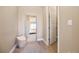 Walk-in closet with a full length mirror and an open door to the bedroom at 775 Woodgate Dr, Highlands Ranch, CO 80126