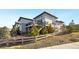 Exterior view of the backyard featuring a multi-story home at 775 Woodgate Dr, Littleton, CO 80126