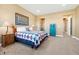 Inviting bedroom with soft lighting, stylish decor, and a comfortable bed, creating a warm and restful atmosphere at 775 Woodgate Dr, Littleton, CO 80126