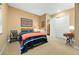 Cozy bedroom features a comfortable bed, colorful decor, and ample closet space, creating a relaxing and organized retreat at 775 Woodgate Dr, Littleton, CO 80126