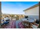 Outdoor deck with a dining table and chairs perfect for enjoying meals outdoors at 775 Woodgate Dr, Littleton, CO 80126