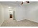 Spacious bedroom with carpet, ceiling fan and attached bathroom and closet at 1950 N Logan St # 102, Denver, CO 80203