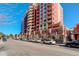 Exterior view of a luxurious high-rise with intricate architectural design and multiple balconies at 1950 N Logan St # 102, Denver, CO 80203