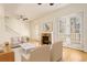 Inviting living room with a fireplace, hardwood floors, and french doors at 1950 N Logan St # 102, Denver, CO 80203