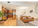 Inviting living space seamlessly connects kitchen and dining areas, featuring hardwood floors and stylish decor at 1950 N Logan St # 102, Denver, CO 80203