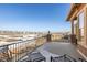 This home features a balcony with metal railings and a beautiful neighborhood view at 9581 Firenze Way, Highlands Ranch, CO 80126