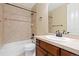 Cozy bathroom featuring a vanity with a sink, a mirror, and a shower with a tub at 9581 Firenze Way, Highlands Ranch, CO 80126