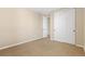 Cozy bedroom with carpet flooring and a door near the closet and wardrobe at 9581 Firenze Way, Highlands Ranch, CO 80126