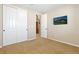 Cozy bedroom with a closet, carpet floors, and a TV at 9581 Firenze Way, Highlands Ranch, CO 80126