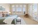 The spacious main bedroom has lots of natural light and neutral colored walls at 9581 Firenze Way, Highlands Ranch, CO 80126