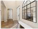Grand entryway with soaring ceilings, tile floors, and an arched mirror at 9581 Firenze Way, Highlands Ranch, CO 80126