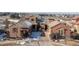 Gorgeous two-story home featuring a stone accents, a tile roof, and a paver driveway and meticulous landscaping at 9581 Firenze Way, Highlands Ranch, CO 80126