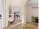 Welcoming foyer with tile flooring and views into the living spaces at 9581 Firenze Way, Highlands Ranch, CO 80126