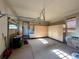 Spacious garage with ample storage, custom cabinets, and epoxy flooring at 9581 Firenze Way, Highlands Ranch, CO 80126