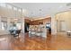 Spacious kitchen with dark wood cabinets, a large island, and stainless steel appliances at 9581 Firenze Way, Highlands Ranch, CO 80126