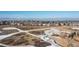 Picturesque community featuring snow-dusted fields and a scenic landscape, complete with walking paths and mountain views at 9581 Firenze Way, Highlands Ranch, CO 80126