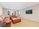Comfortable living room with plush leather seating and natural light at 9581 Firenze Way, Highlands Ranch, CO 80126