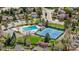 Aerial view of community pool and tennis courts with mature landscaping at 4967 E Lake Ave, Centennial, CO 80121