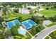 Aerial view of tennis courts and pool near school and playground at 4967 E Lake Ave, Centennial, CO 80121