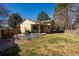 Backyard featuring mature trees, a patio, and a grassy area at 4967 E Lake Ave, Centennial, CO 80121