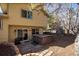 Backyard view features a jacuzzi and a sliding door entrance to the home at 4967 E Lake Ave, Centennial, CO 80121