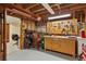 Unfinished basement area with exposed wooden beams and peg board at 4967 E Lake Ave, Centennial, CO 80121
